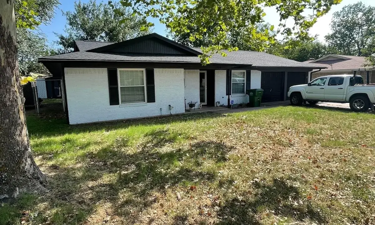Professional roofing crew working on a residential roof in Centerville